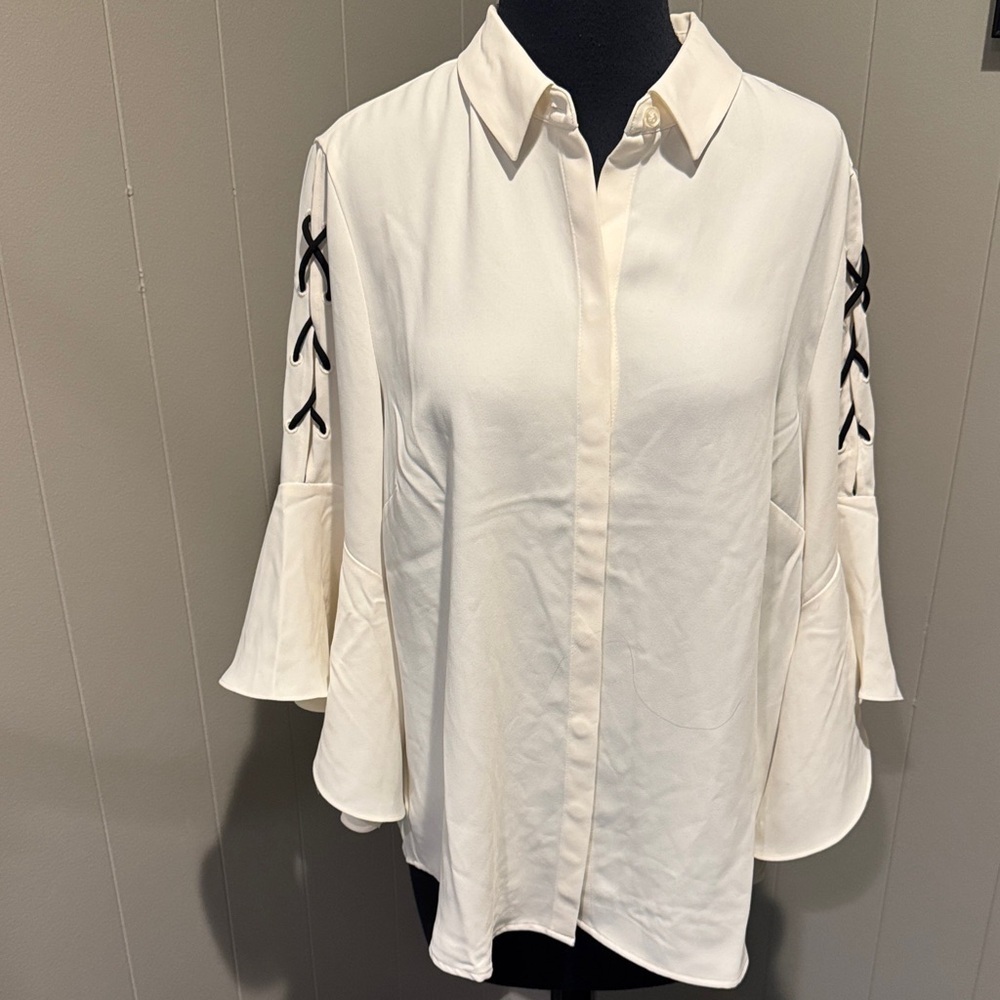 Chico’s ivory crepe hidden button front flounce ruffle lace-up sleeve blouse.